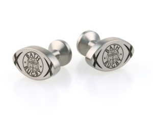 a pir of cufflinks engraved with the Bath Rugby logo